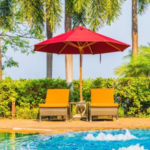 Portrait beautiful young asian woman relax around swimming pool in hotel resort for leisure in vacation